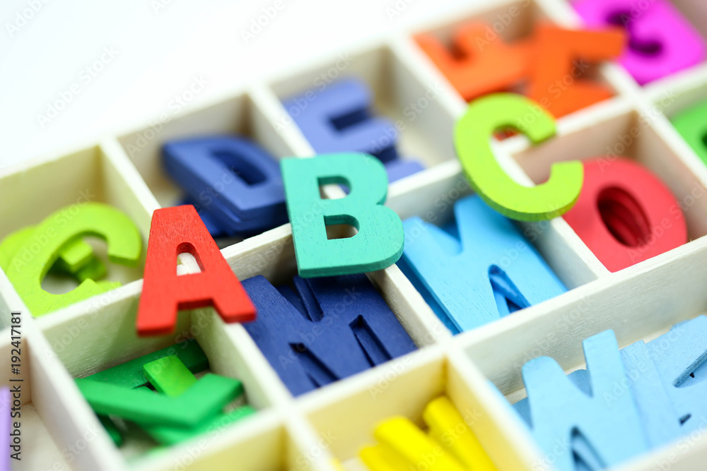 Fototapeta premium Close up Colorful wooden English alphabe on white background.