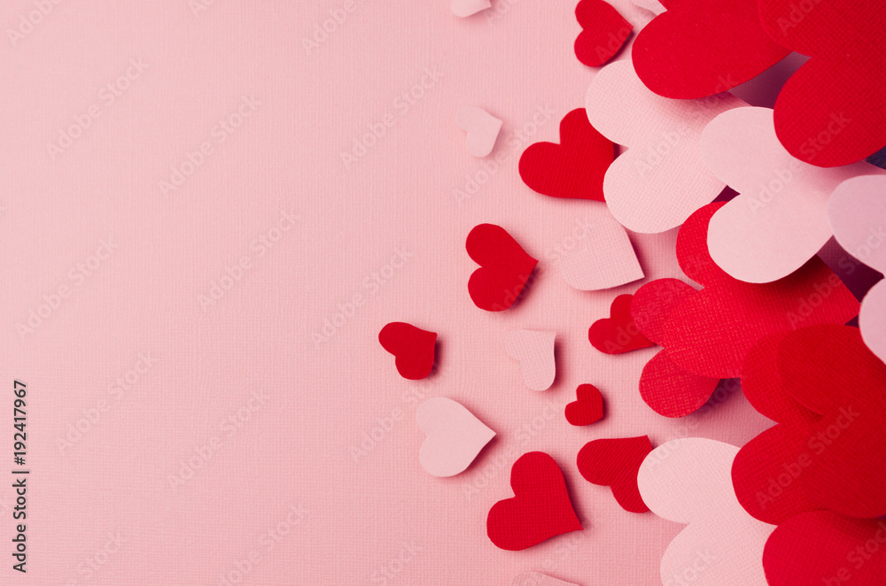 Valentine day background of fly paper red and pink hearts on pink color backdrop. Copy space. Valentine day background of fly paper red and pink hearts on pink color backdrop. Copy space.