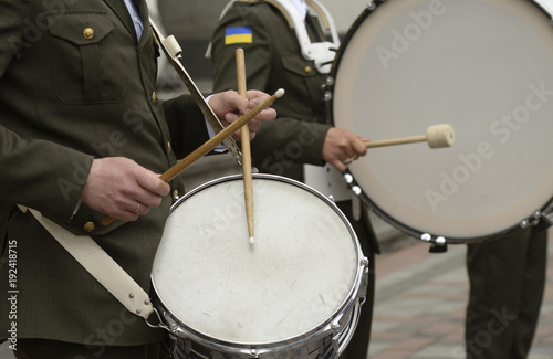 Military orchestra musician’s hand’s playing drums