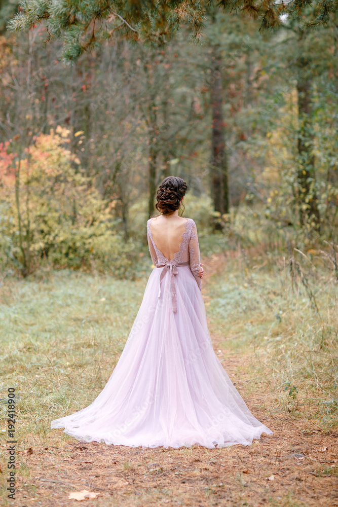 Beautiful bride brunette. The autumn wedding.