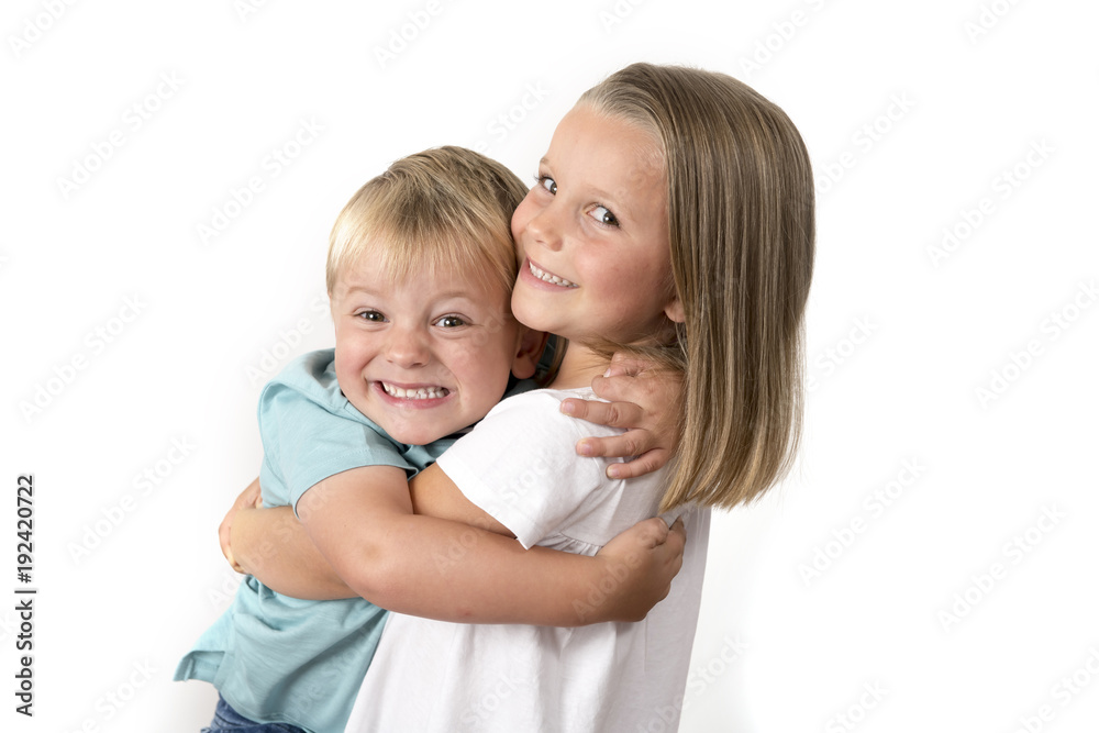 7 years old adorable blond happy girl posing with her little 3 years old brother smiling cheerful isolated on white background 7 years old adorable blond happy girl posing with her little 3 years old brother smiling cheerful isolated on white background
