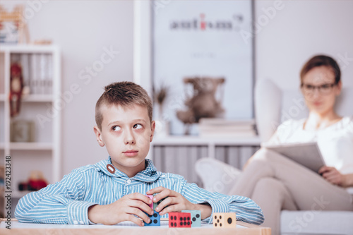 Boy playing with dice photo