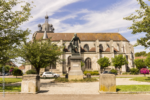 The Place de la République, with the statue of Georges Jacques Danton and the Church of Saint-Étienne in the background. Arcis-sur-Aube, Grand Est, France