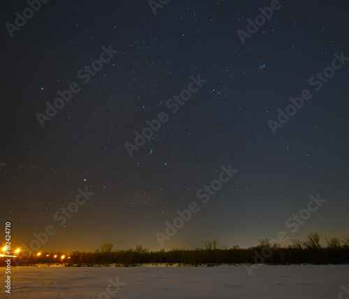 Stars in the night sky over the frozen river Don in Russia.