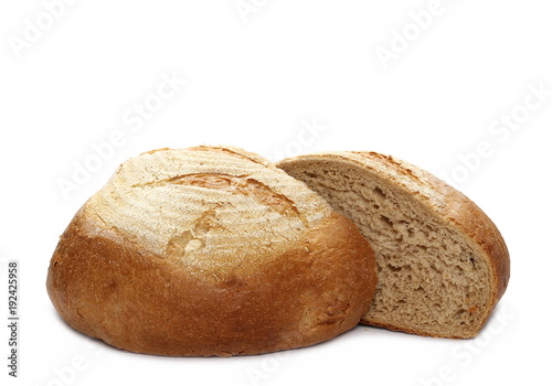 Loaf of wheat bread sliced in half isolated on white background