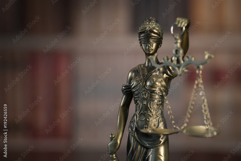 Law and Justice concept. Law books on background