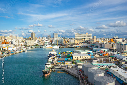 Tomari Port with Okinawa city skyline in Naha, Okinawa, Japan photo