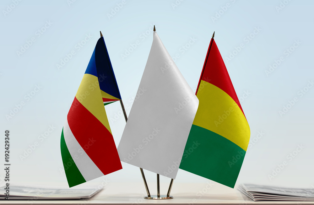 Flags of Seychelles and Guinea with a white flag in the middle Flags of Seychelles and Guinea with a white flag in the middle