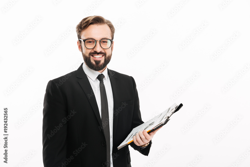 Happy businessman holding documents. Happy businessman holding documents.