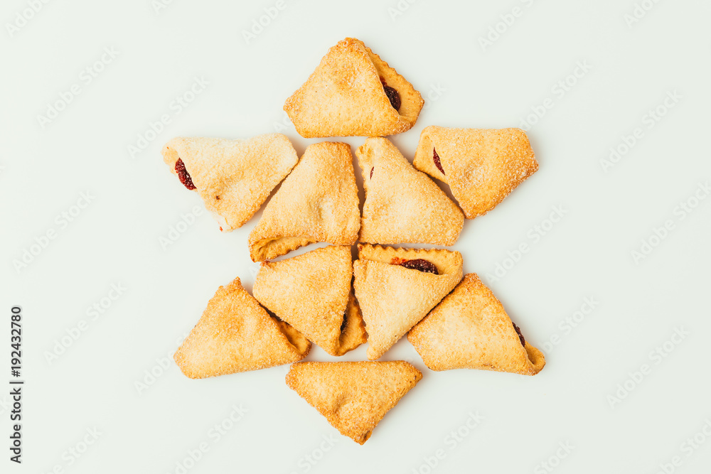 top view of star made of cookies isolated on grey, purim holiday concept
