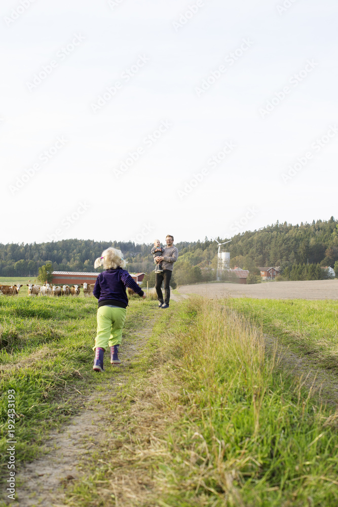 Man with his daughters on farm in Bergum, Sweden Man with his daughters on farm in Bergum, Sweden
