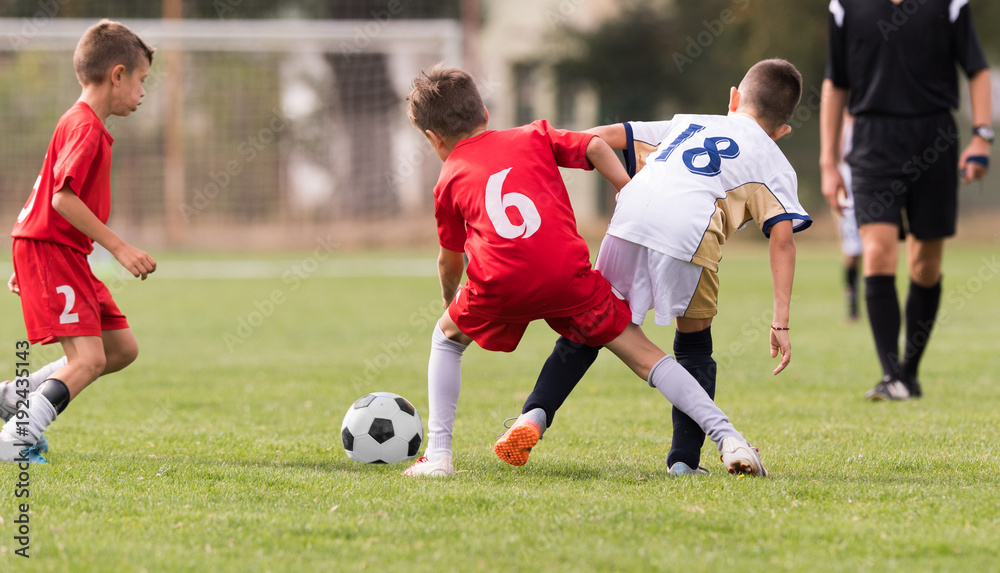Young children players football match on soccer field