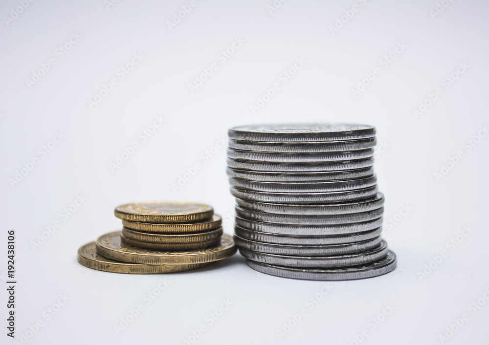 Coin stacks on a white background, pile of coins heap of coins silver gold, copper thai coin Coin stacks on a white background, pile of coins heap of coins silver gold, copper thai coin
