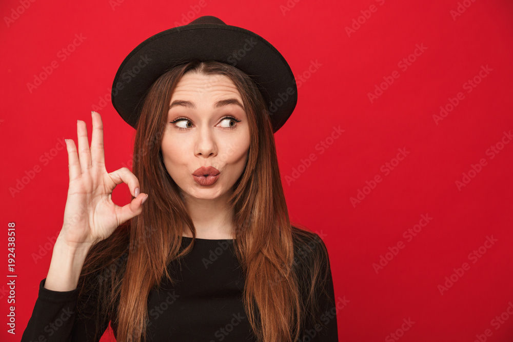 Smiling young woman showing okay gesture. Smiling young woman showing okay gesture.