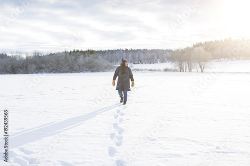 Woman walking in snow photo