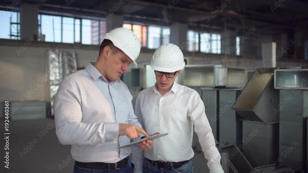 supervisor or architect designer using pc tablet. slow-motion supervisor or architect designer using pc tablet. slow-motion