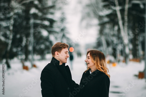 Winter LoveStory in Valentine's day. Girl and guy happy and smiling photo