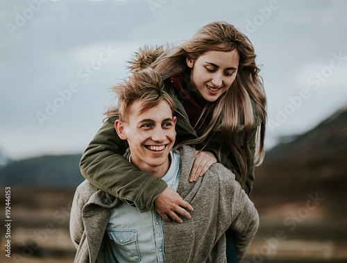 Loving young couple playing outside
