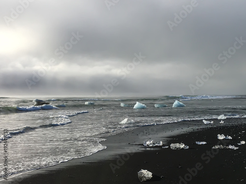 Small icebergs swept up on black sand beach in Iceland © Christopher Ingham