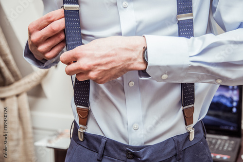 Photos Man is preparing to get dressed up