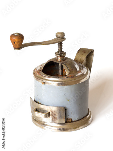 Old retro coffee mill on white background, vintage hand-mill. Coffee grinder old