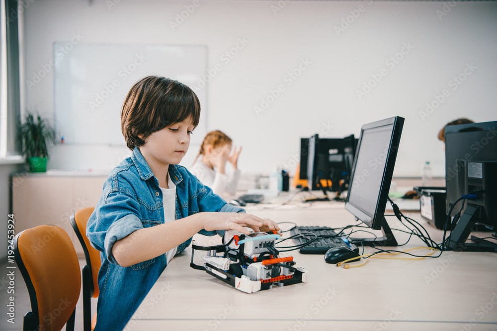 teen kid programming diy robot at machinery class