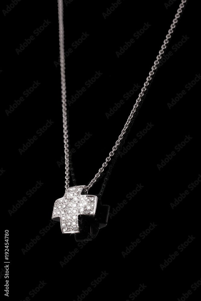 Precious platinum chain with cross diamonds on black background. Precious platinum chain with cross diamonds on black background.