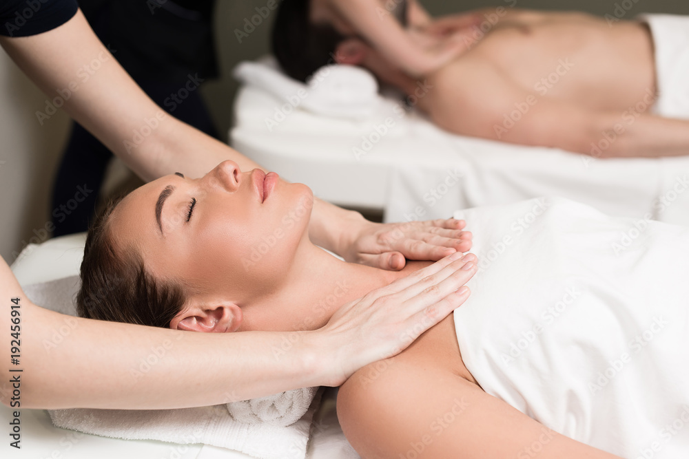 selective focus of couple having massage in spa salon selective focus of couple having massage in spa salon