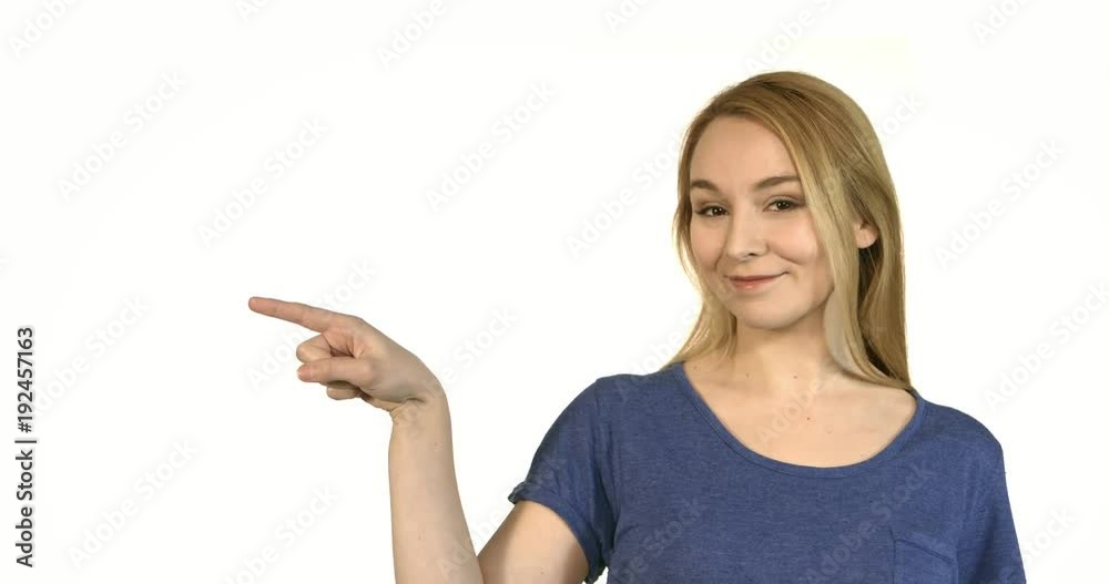 Smiling business woman pointing finger at copy space. Smiling business woman pointing finger at copy space.