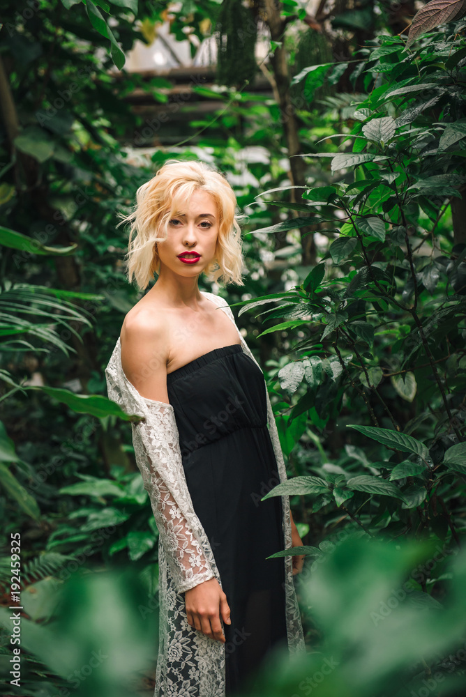 Seductive blonde female model at the rainforest Seductive blonde female model at the rainforest