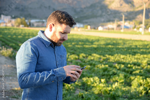 farmer using phone outdoors