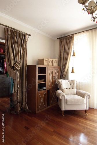 vintage room with wooden cupboard and armchair style. © UnitedPhotoStudio