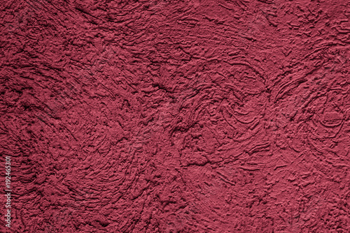Rough plastered surface painted in magenta color - copy space