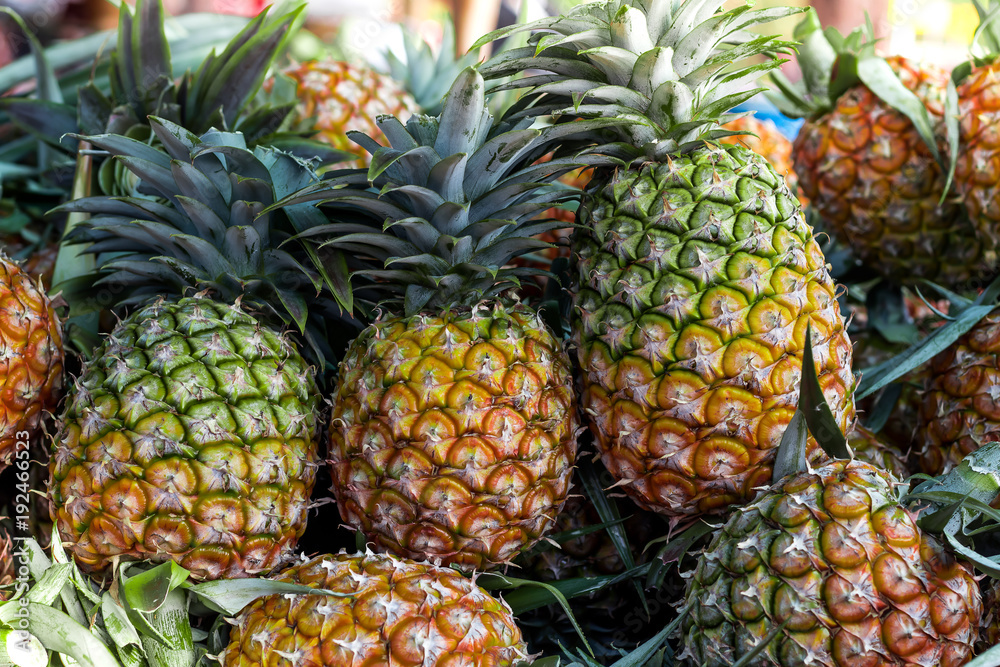 Pineapple background/ lots of ripe yellow pineapples/ market asia fruit food pineaple tomato vegetables street Pineapple background/ lots of ripe yellow pineapples/ market asia fruit food pineaple tomato vegetables street