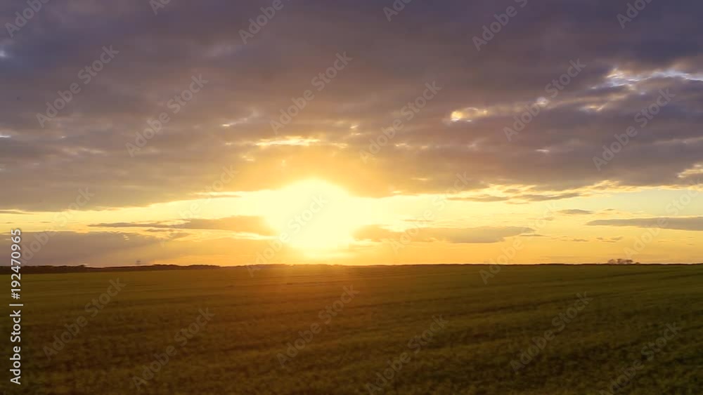 Natural Sunset Sunrise Over Field Or Meadow. Bright Dramatic Sky Over Ground. Countryside Landscape Under Scenic Colorful Sky At Sunset Dawn Sunrise. Skyline, Horizon. Warm Colours Natural Sunset Sunrise Over Field Or Meadow. Bright Dramatic Sky Over Ground. Countryside Landscape Under Scenic Colorful Sky At Sunset Dawn Sunrise. Skyline, Horizon. Warm Colours
