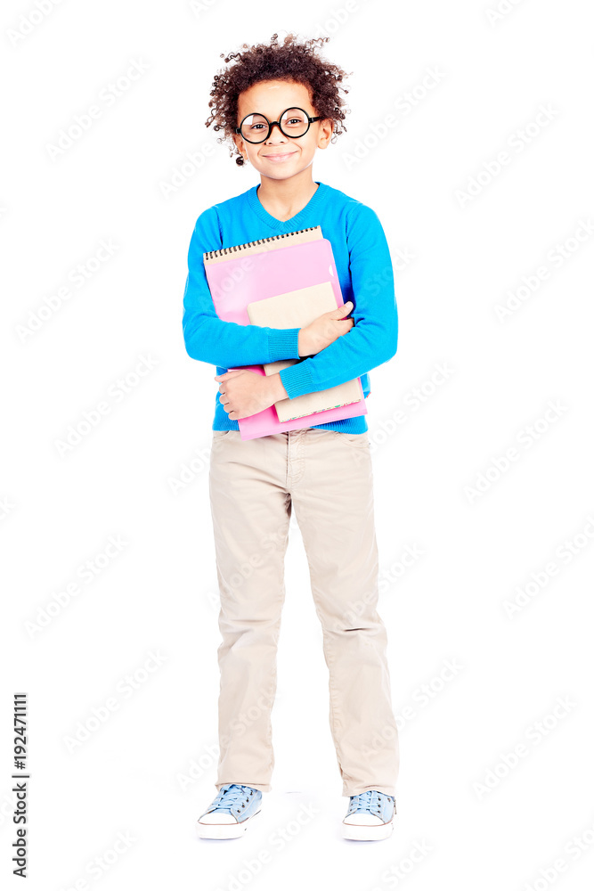 Fototapeta premium Portrait of cute curly-haired Latin American elementary student wearing eyeglasses