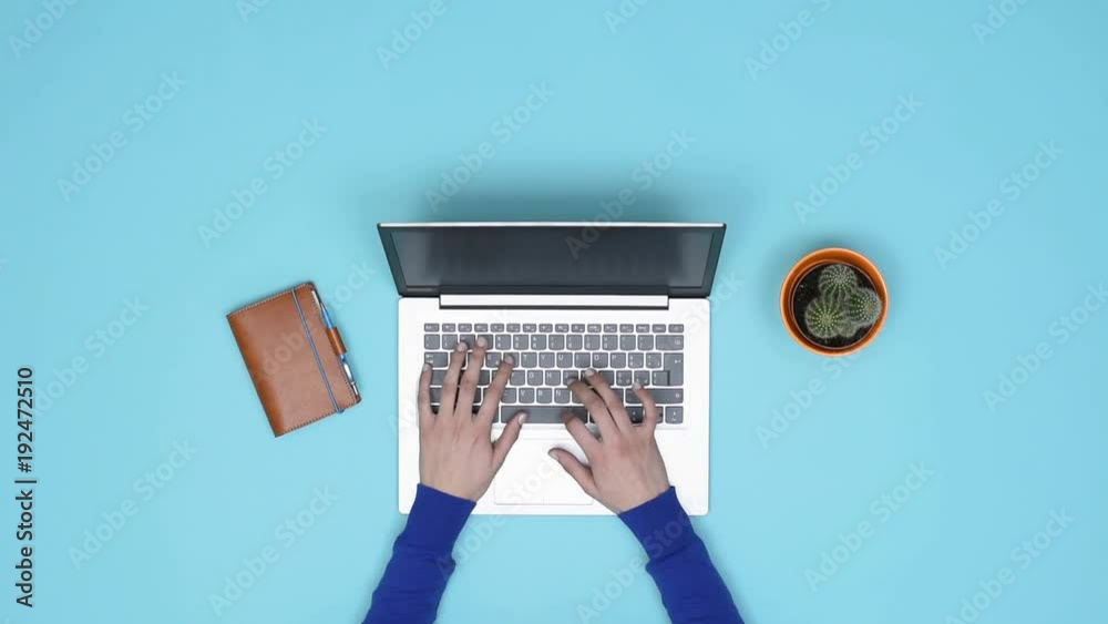 Minimalist desktop and woman working with a laptop Minimalist desktop and woman working with a laptop