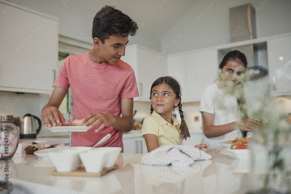 Siblings Preparing the Food