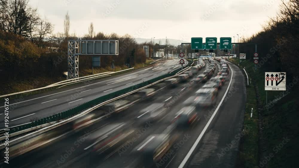 Time lapse of heavy flow of traffic on highway at the border between Switzerland and France. Time lapse of heavy flow of traffic on highway at the border between Switzerland and France.