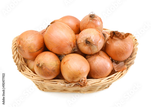 fresh onions vegetables isolated in basket on white background