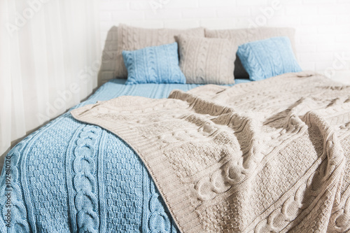 bedroom bed blanket plaid blue beige photo