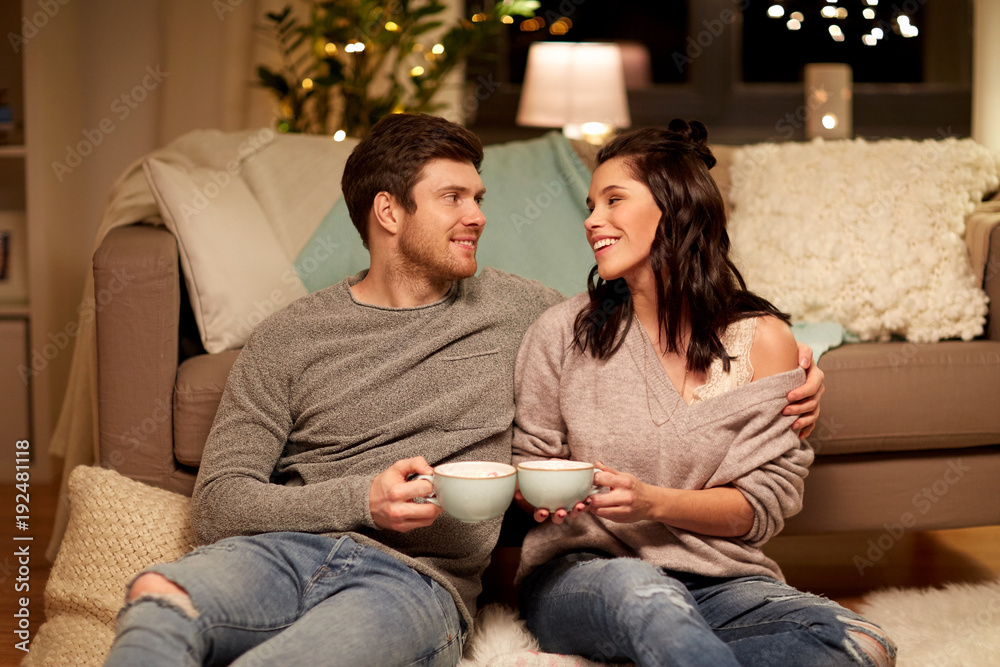 happy couple drinking cacao at home happy couple drinking cacao at home