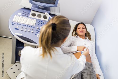 Young woman on ultrasound e...