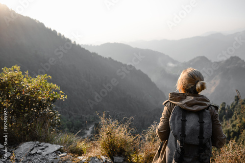 Backpacker girl in the mountains