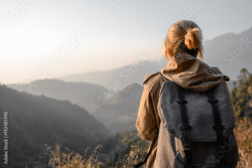 Backpacker girl in the mountains