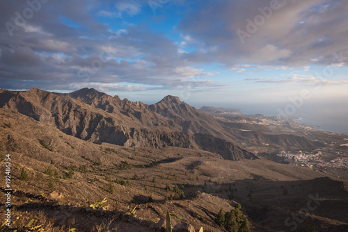 Tenerife mountain landscape. Trekking path. Adeje and Las Americas coastline in the background.