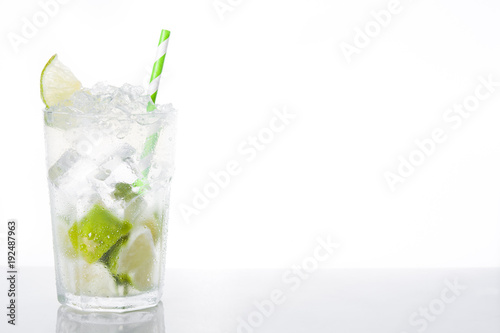 Caipirinha cocktail in glass on white background. Copyspace    