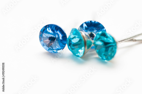 Blue green gems close up macro shot isolated on white background.