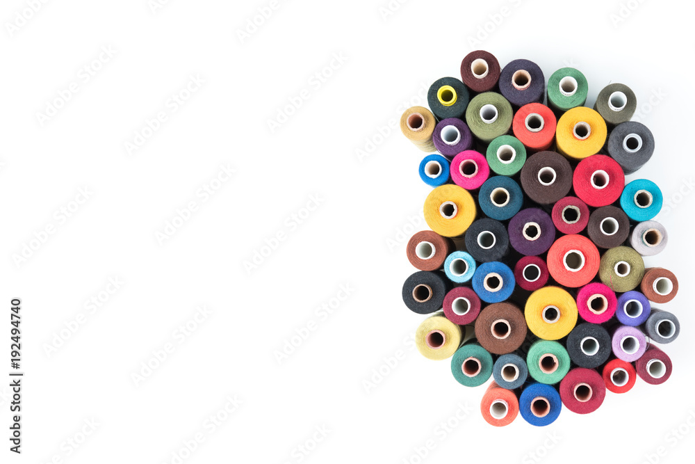 Set of coloured thread coils on white background, sewing supplies, text ready, banner, book or magazine cover, textile background Set of coloured thread coils on white background, sewing supplies, text ready, banner, book or magazine cover, textile background