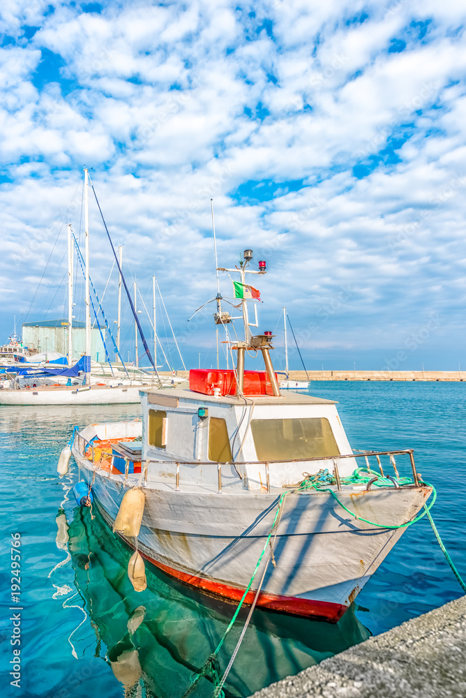 Boat moored at Monopoli port - Italy, Puglia. Adriatic sea